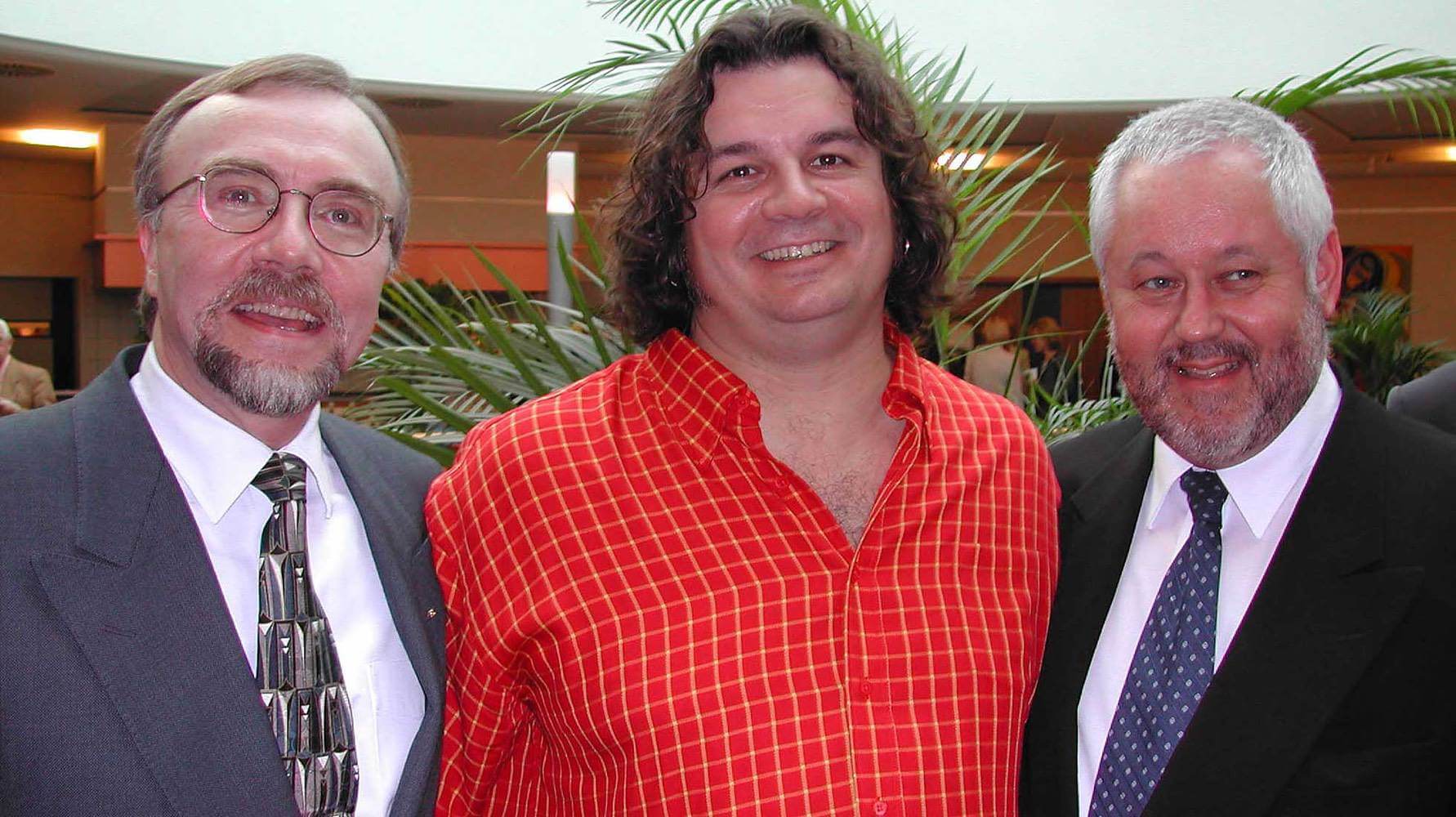 Photo of artist Michael J. Korber at his Gala Event at Club Monet in Luxembourg City, with Gerald J. Loftus, Ambassador from the United States Embassy, and Paul Schoemenberg Chairman of the A.S.B.I Luxembourg